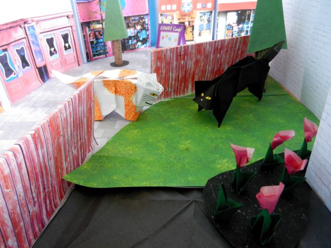 origami cats in a papercraft backyard