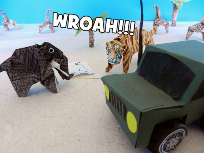 elephant threatened by an origami tiger