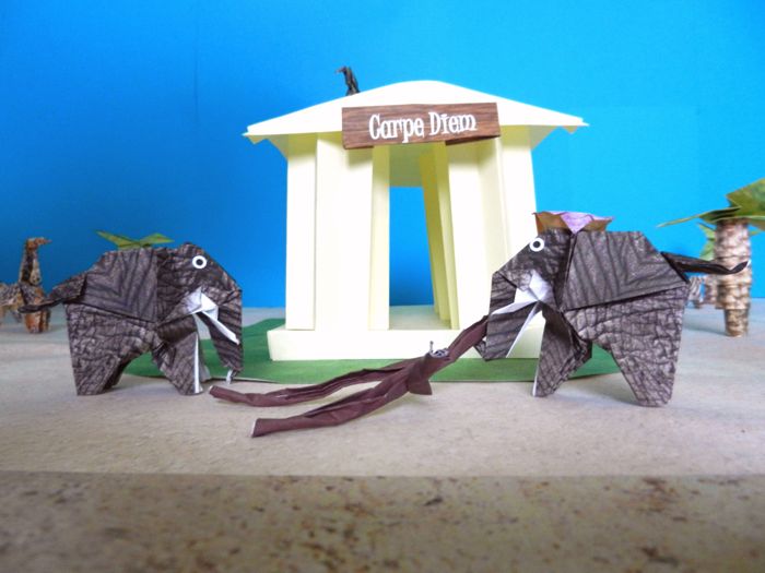 paper elephants at an origami greek building