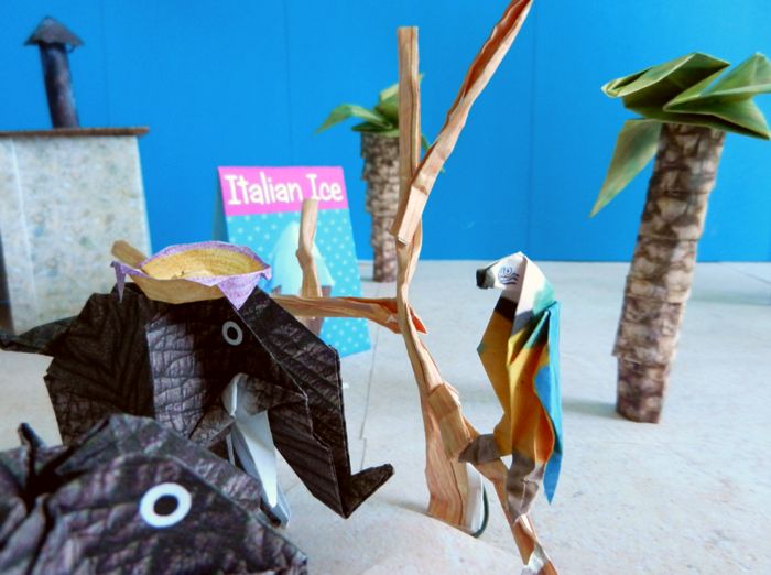 paper elephants talking to an origami parrot