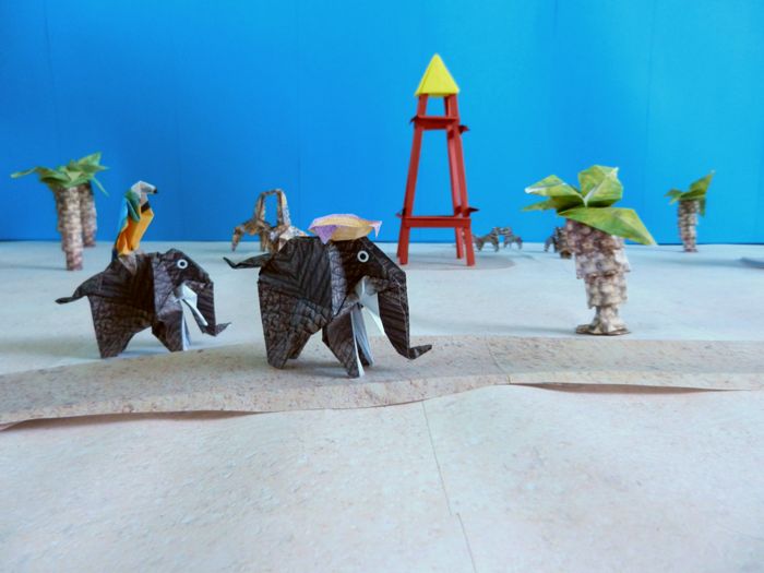 origami animals traveling through the desert