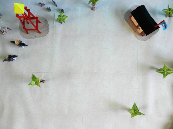 top view of a kirigami house and toy tower