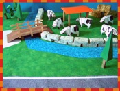 jigsaw puzzle of lots of origami cows on a farm