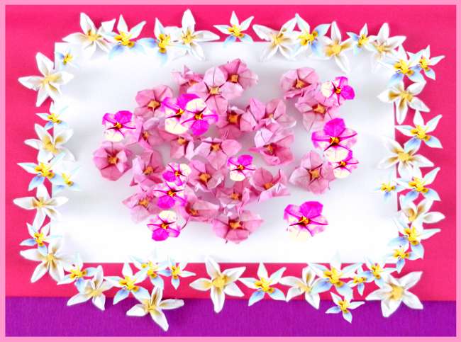 Roze en witte bloemetjes van papier