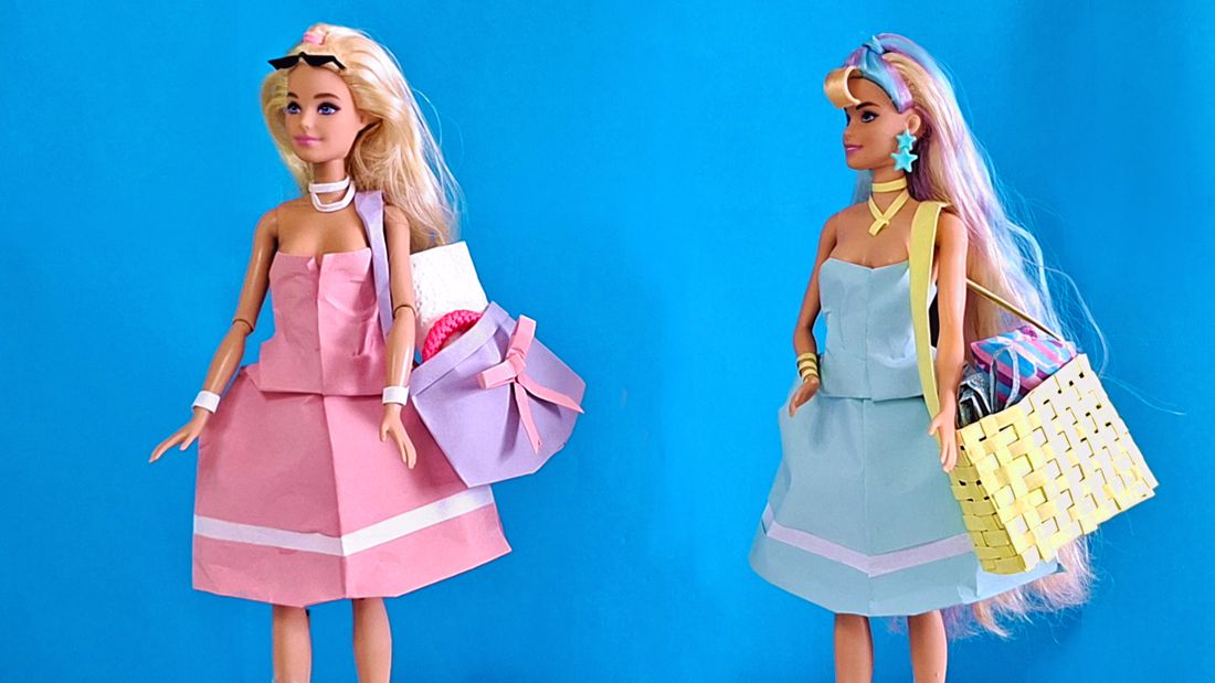 Dolls in paper nautical dresses